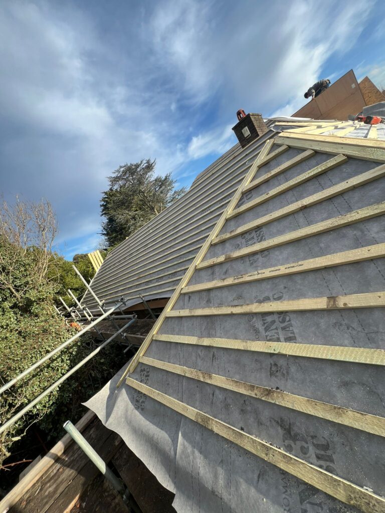 Roofers in Streatham carrying out a new roof installation with breathable membrane and timber battens