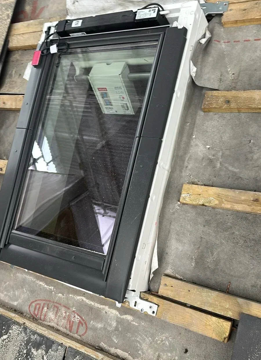 VELUX roof window installation on a pitched tiled roof in Cobham, Surrey by Cobham Roofing